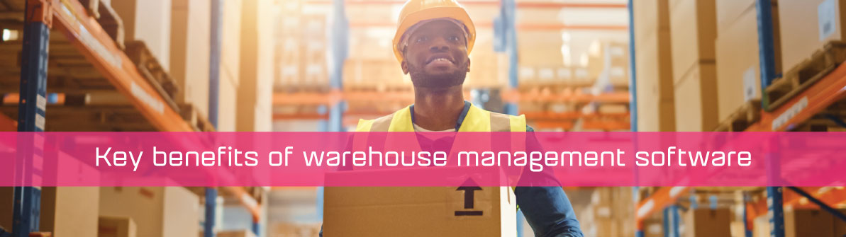 A warehouse employee carrying a box in a warehouse with a strap that reads Key benefits of warehouse management software