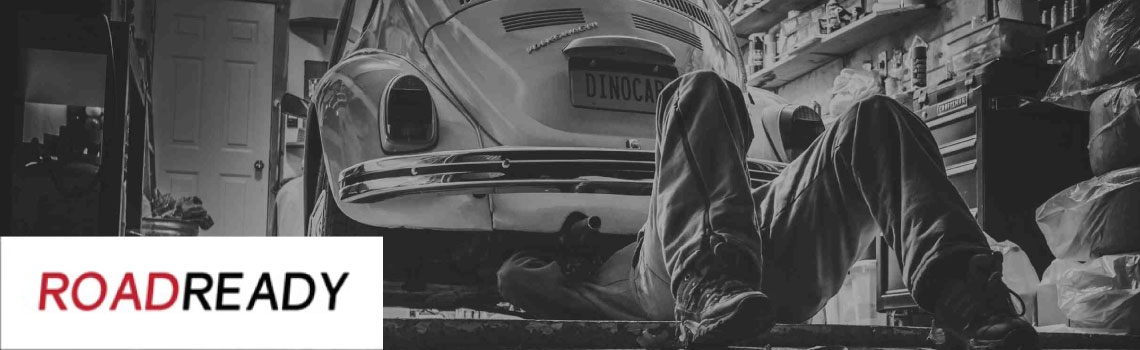 A mechanic working under a car.
