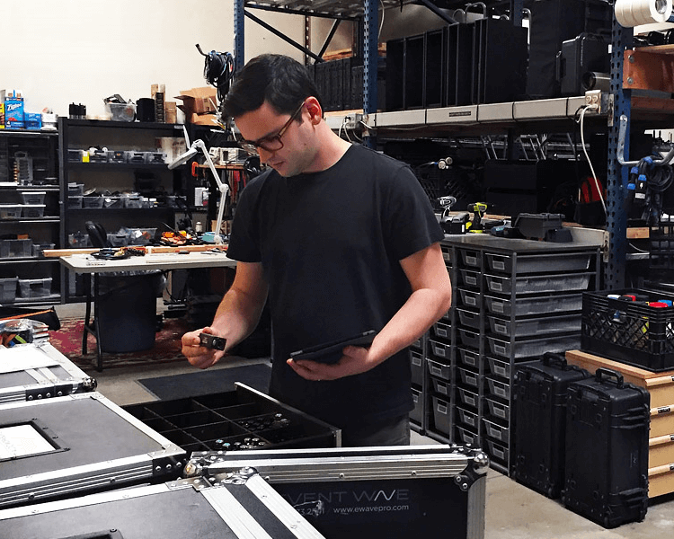 A man looking at audio tools.