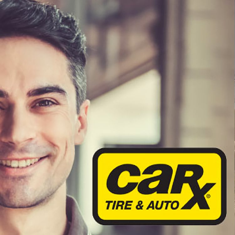 A man smiling with the Car-X Tire and Auto logo.