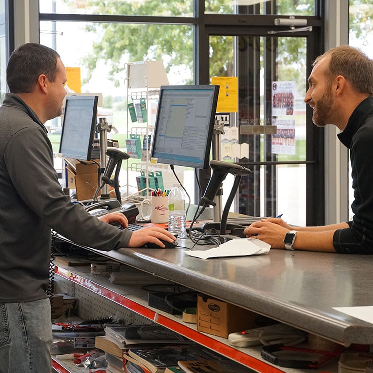 Two men in an Irish store preparing to make a payment