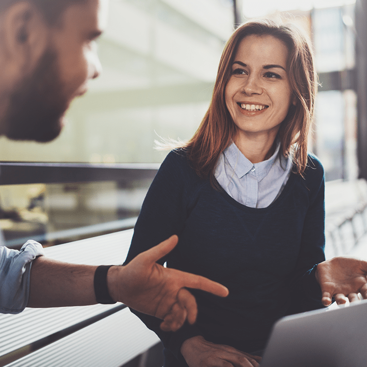 A man and woman discussing the use of cloud on KCS's rental software.