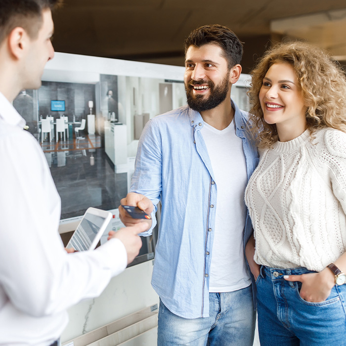 A couple making a payment using a credit card