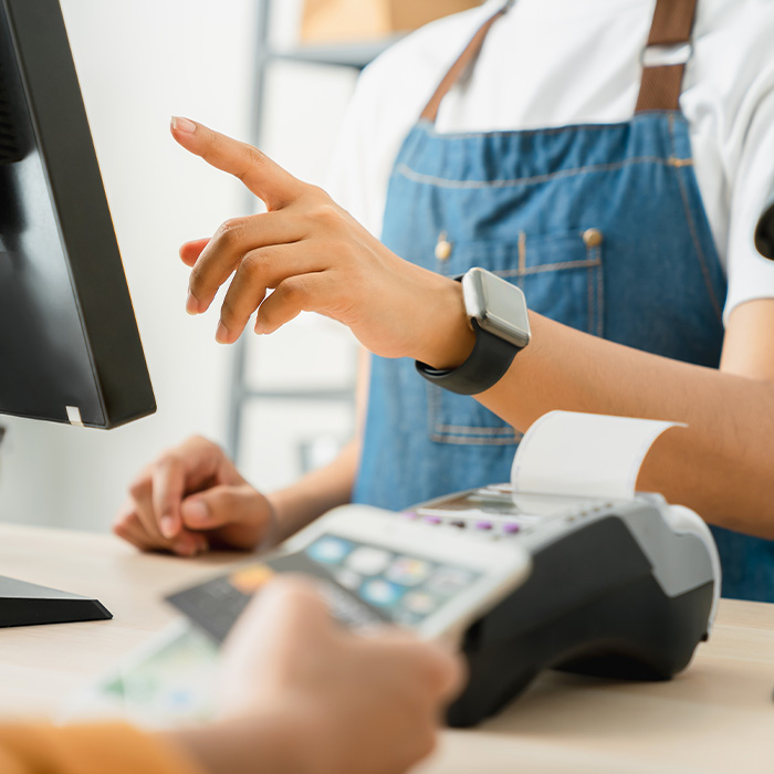 A person using a credit card to make a payment.