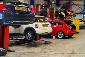 Brackmills MOT Centre with cars in for repairs