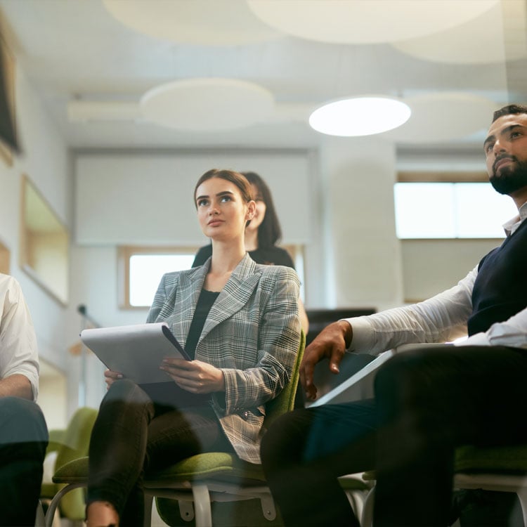 A group of professionals discussing in a meeting room