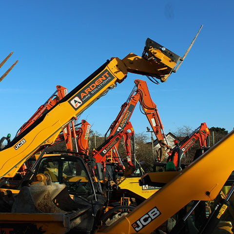 A group of Ardent construction equipment parked next to each other